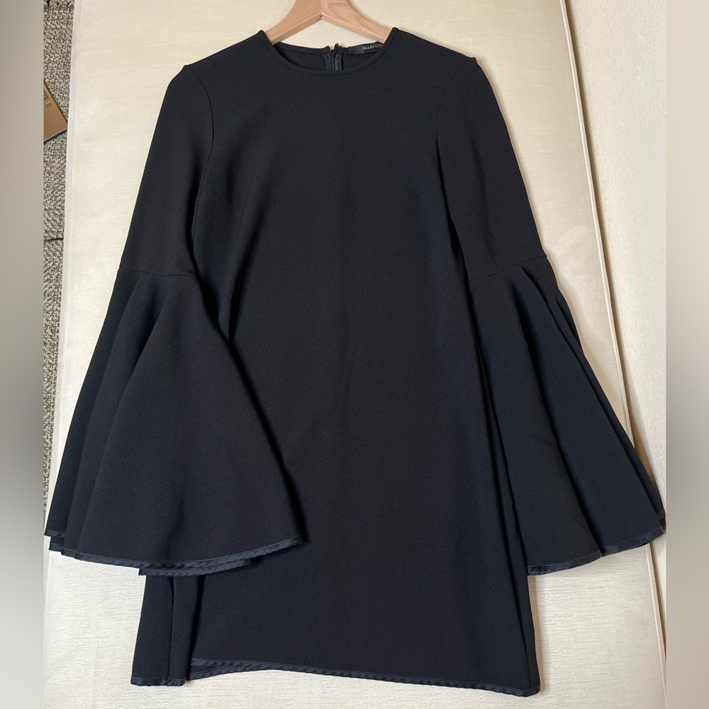 Ellery black dress with statement bell sleeves and quiet luxury energy aesthetic